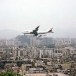 HKG-Hong-Kong-a-Jumbo-Jet-approaches-Kai-Tak-Airport